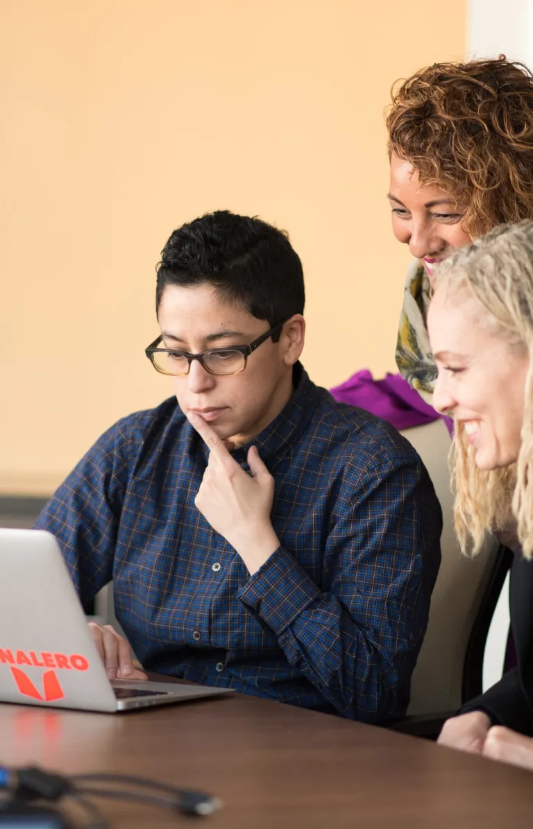people looking at a computer