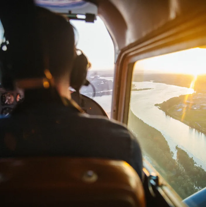 pilot flying a plane