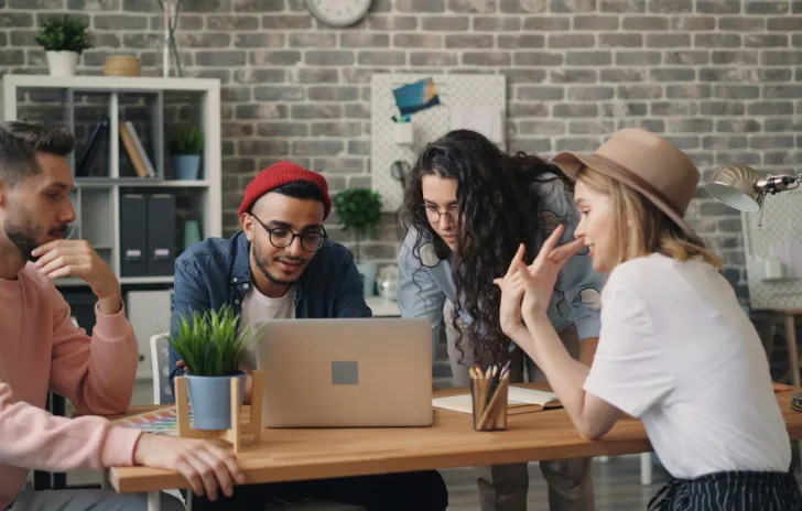 people all around a computer